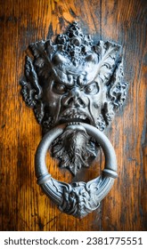 Door knocker with devil image