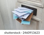 Door, letter and mail or envelope in box of home for communication or notice, stacked and overflowing with documents. Mailbox, post and address for mortgage or debt, message and paper from bank.