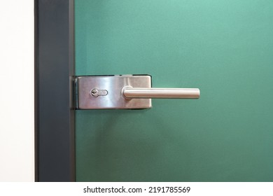 Door Lock And Doorknob On Close Glass Door In Office. Detail Of Contemporary Door Lock With Doorknob For A Glass Door In Office