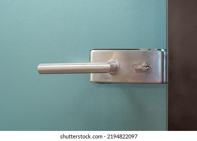 Door Lock And Doorknob On Close Glass Door In Office. Detail Of Contemporary Door Lock With Doorknob For A Glass Door In Office