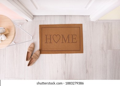 Door Mat With Shoes In Hallway