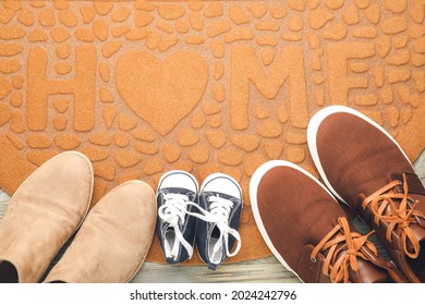 Door Mat And Shoes On Floor