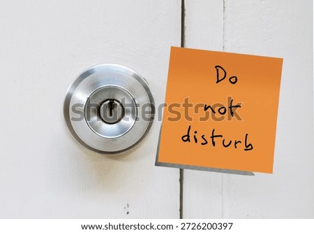 Door with note written DO NOT DISTURB, to ask for privacy respect, introvert needs personal space - setting social boundaries