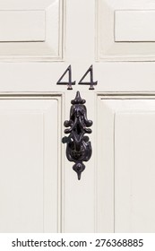 Door Number 44 With Door Knocker Close Up