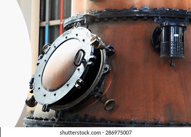 Door On A Copper Gin Kettle In A Distillery.