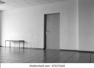 Door On The Wall In An Office Room Tiled Floor