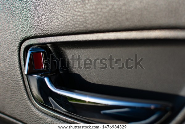door opener in a car with an open door indicator\
of red color.