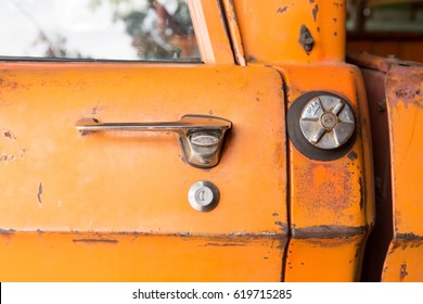 Door Opener Of Vintage Rusty Orange Truck Car