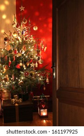 Door Opening Into A Room Decorated For Christmas 