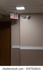 Door Over Exit Sign In Hallway