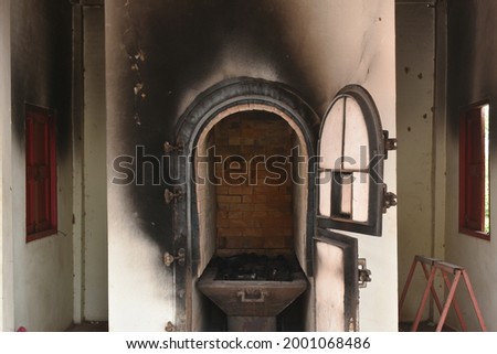 door for push coffin to burning in cremation furnace building 