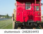 Door to a railroad caboose car with copy space to left