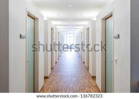 Door rooms in dorm and windows at the end
