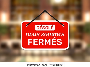 Door sign shop panel write in french désolé nous sommes fermés means sorry we are closed on store entrance. - Shutterstock ID 1953684805