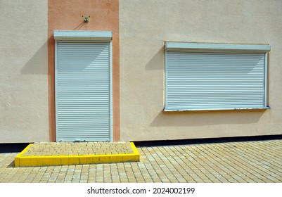 Door and window with lowered anti-burglary roller shutters