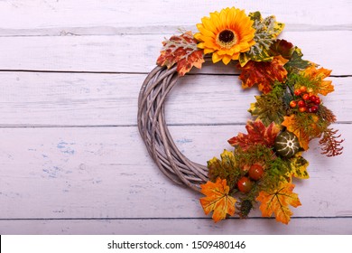 Door Wreath Made Of Artificial Flowers And Autumn Plants On Shabi White Wooden Background.