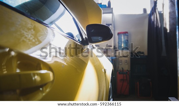 Door
of yellow car in garage auto service - for
repairing