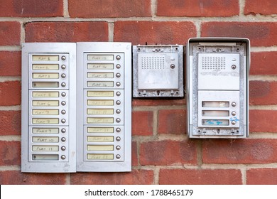 Doorbells or intercoms outside a block of flats or apartments with the flat numbers written next to the buttons - Shutterstock ID 1788465179