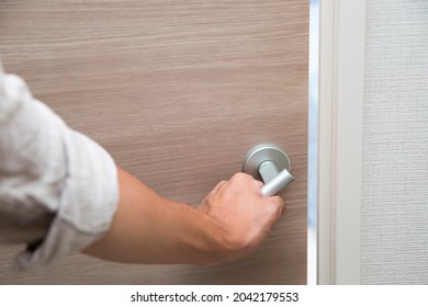 Doorknob, grip, man holding a clean doorknob