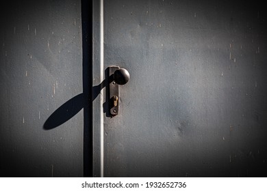 doorknob on a steel door with shadow