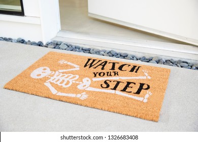 Doormat Outside Open Front Door Of House