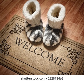 Doormat with text Welcome. Cleaning foot carpet with shoes made of sheep wool