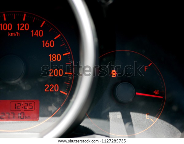 Door-open-warning light on a car dashboard is on,\
showing that at least one of the doors isn’t closed properly, all\
the way\
through