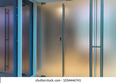 Doors In A Man's Toilet From Frosted Glass