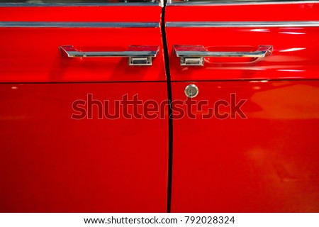Doors of red retro car.