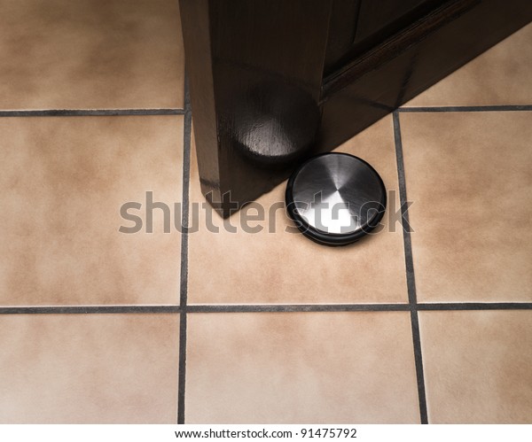 Doorstop Holding Door On Ceramic Floor Stock Photo Edit Now 91475792
