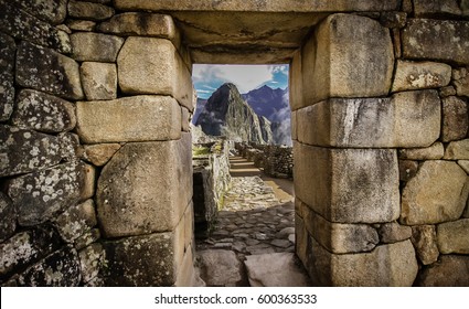Doorway at Machu Picchu frames a view of Huayna Picchu,  Machu Picchu, Unesco World Heritage site, Sacred Valley, Peru 