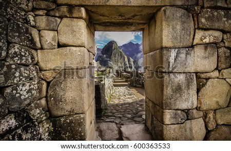 Doorway at Machu Picchu frames a view of Huayna Picchu,  Machu Picchu, Unesco World Heritage site, Sacred Valley, Peru 