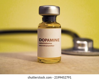 Dopamine Medical Bottle With Stethoscope In Background. Medication Used In Treatment Of Very Low Blood Pressure, Slow Heart Rate And Cardiac Arrest