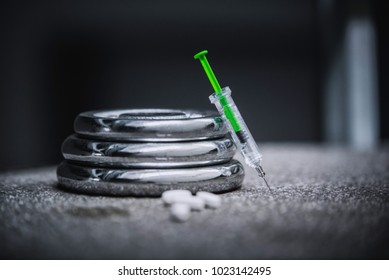 Doping Concept Photo, Green Syringe In Gym. Body Building