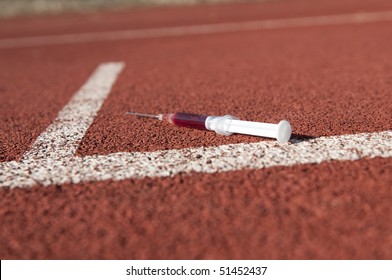 Doping Syringe On Athletics Sports Area