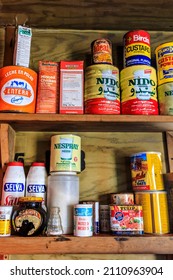 Dorian Bay, Antarctica - 12 10 17: Preserved British Antarctic Survey hut (Damoy hut) interior with historic food supplies and provisions, including tins and cans,  on wooden pantry larder shelves