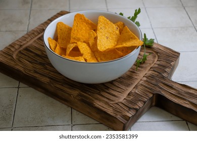 Doritos in a plate on an old background