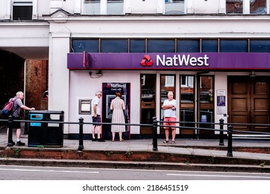 Dorking, Surrey Hills, London UK, June 30 2022, NatWest High Street Retial Bank Sign And Logo People Withdrawing Cash From ATM Cash Point Machine