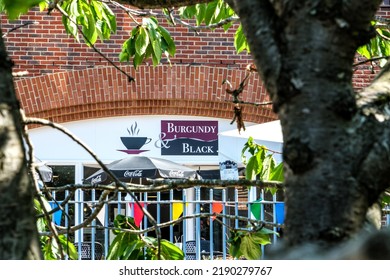 Dorking, Surrey Hills, London UK, August 13 2022, Burgundy And Black Restaurant Or Cafe Building Exterior With No People