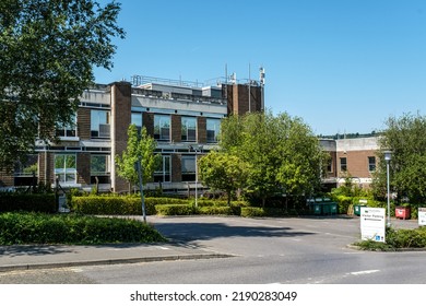 Dorking, Surrey Hills, London UK, August 13 2022, Low Rise Commercial Office Block Or Development With Blue Sky And No People