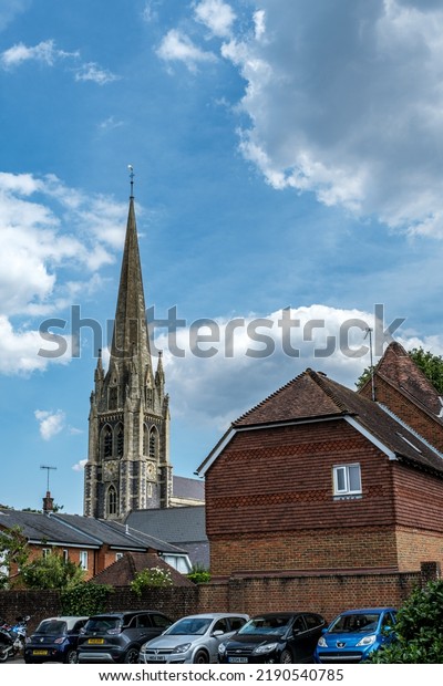 Dorking, Surrey Hills, London UK, August 14 2022,\
Dorking Town Centre St Martins Church Steeple Against A Bright\
Cloudy Sky