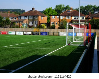 Dorking, Surrey, UK- JULY 6 2018: The New Dorking Wanderers Football Stadium, Showing The Astro Turfed Pitch With Surrounding Sponsor Banners.