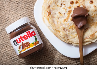 DORKOVO, BULGARIA - DECEMBER 12, 2017: Pancakes with Nutella. Introduced to the market in 1964 by Italian company Ferrero, Nutella is widely popular brand name of a chocolate cream 
