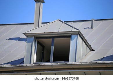 Dormer With Zinc Cladding On A Tiled Roof