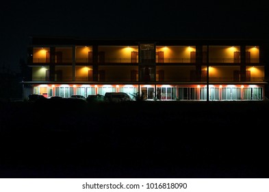 Dorms At Night Yellow Building With Down Light