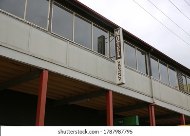 Dorrigo, NSW / Australia - July 11th 2020 - A Creepy Motel Vacancy Sign On An Abandoned Hotel