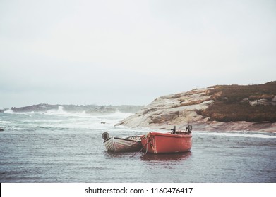 Dory boats anchored in Peggy's Cove after a hurricane.
