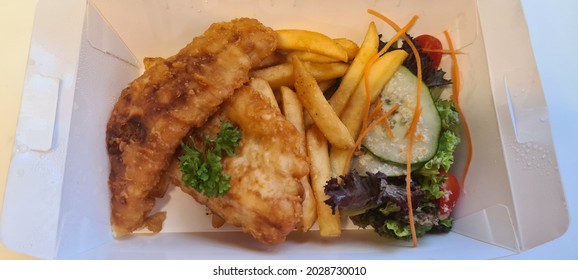 Dory Fish Fillet And Chips Bento Set With Salad As Side Dish In Take Away Box Packing. Selective Focus.