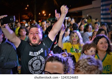 São José dos Campos, São Paulo / Brazil - 10/28/2018 - Voters thrilled for Bolsonaro's victory for President in concentration in front of the screen for counting votes