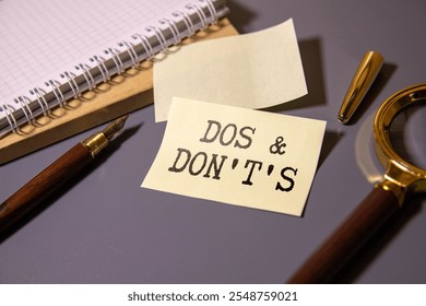 Do's and Don't's Message. text on yellow paper on torn paper background.